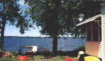 View of lake and dock from beside the Cottage.  The view is looking west across the Missiquoi Bay. 