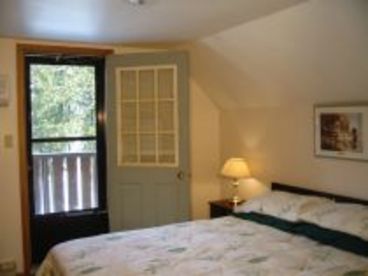 The master bedroom has a balcony overlooking the beach.