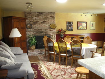 Dining room table seats 8, extends to 10; kitchen counter seating with 4 bar stools.