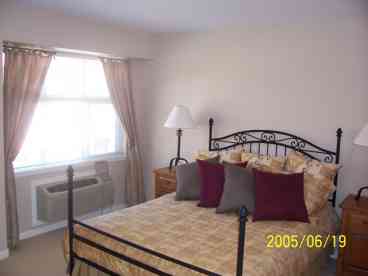 Bedroom features walk-in closet and unobstructed stunning lakeview!!