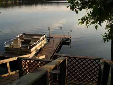 View of dock and boat available for rent.