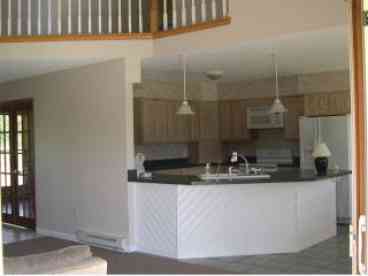 Large spacious kitchen with modern appliances.