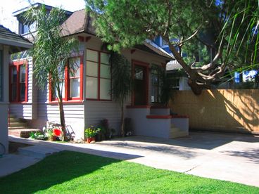 1910 Classic Three Bedroom House and front yard taken from the walk street