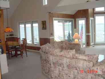 Partial view of the spacious great room area and part of one dining area.
