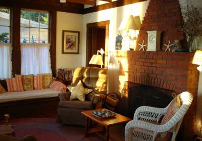 Oceanfront living room with wood fired fireplace, TV, DVD, stereo