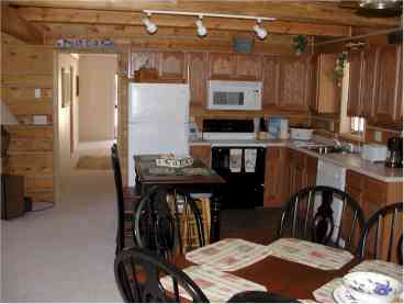 Our large kitchen with adjoining dining area and Great Room provide plenty of room for large families to enjoy each others company while preparing fun family meals on vacation!