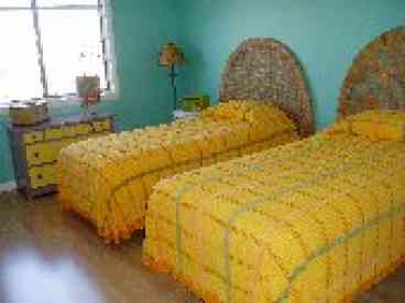 Upstairs twin bedroom with two twin beds