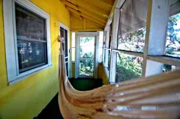 Side screened porch with hammock