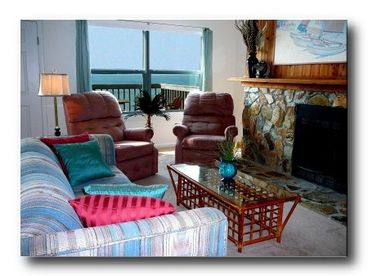 Cozy seating in front of fireplace w/great ocean view (this area also has tv/vcr/dvd player and compact stereo system)
