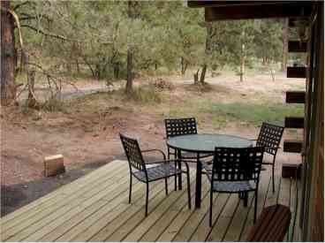 Looking toward the forest - a quiet spot to enjoy lunch, or stretch out on the chairs on the other portion of the porch and enjoy a good book!
You won't see the deer watching you!