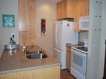 Beautiful kitchen with granite counter tops.