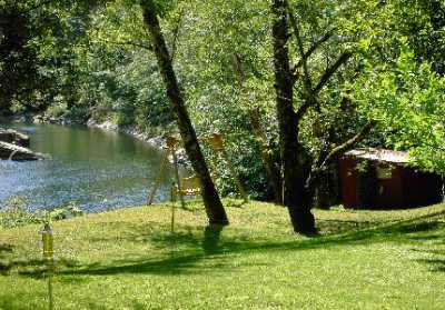 Fish Shack and Swing by Riverbank