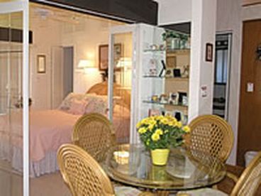 dining area with french doors leading into the bedroom