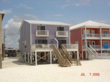 Gulf front 2 level duplex.  3BR/2BA w/2 private decks.  Huge private beach and still close to town.  BBQ grill on site, stereo w/CD, W/D, icemaker, D/W. Sleeps 8
