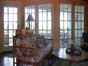 Sunken  Family room off kitche opening to covered patio porch with BBq