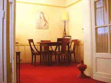 Partial living room view showing dining area