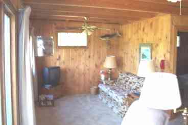 Living room with couch and local TV.