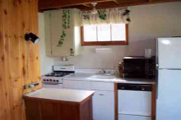 Kitchen with microwave, dishwasher,
