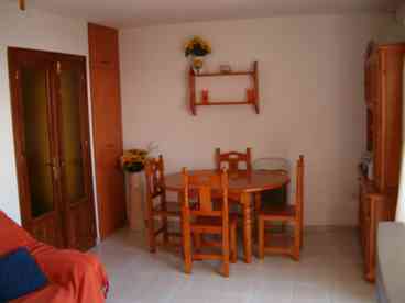 Lounge Diner: A good size room furnished with two sofas, coffee table, pine dining table & six chairs, pine dresser with cupboards and drawers, Colour T.V. with English satellite Channels & patio doors leading to large Balcony with sea & country views, with patio furniture for outside dining. 