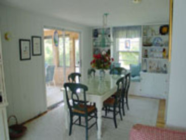 dining room with screen porch off to the left side of room