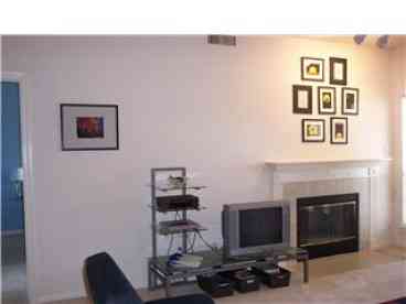 Living Room with fireplace and entertainment center