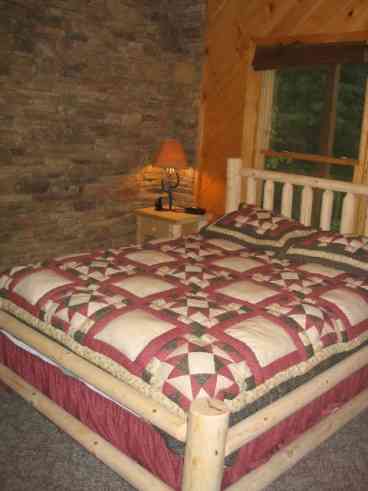 Lower level Bedroom:  Queen bed (photo distorted)