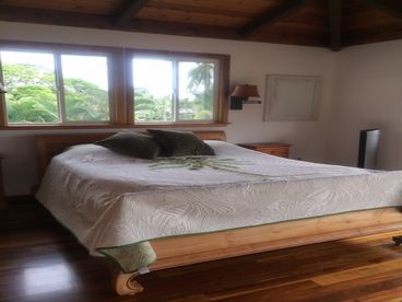 The master suite is lovely with views of the ocean, the mountain pali, and opens onto a balcony with lounge chairs. It also has a sitting room and office space and bath with 2 shower heads.