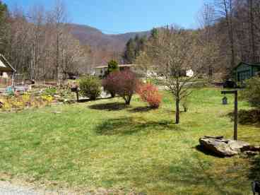 Relax on the covered porch and enjoy a view of Snowball Mountain, surrounded by the sounds of creeks, waterfalls, wind and birdsong.