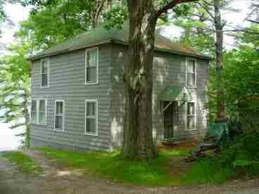 LedgeLawn Cottage was built around the turn of the century. It has a large open hearth fireplace in the main room, a kitchen and dining area, and a bathroom on the first floor. and a deck overlooking the water and sunset The second floor has three large bedrooms with accommodations for seven. 

