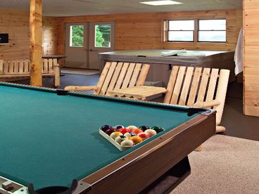 Game Room equipped with fireplace, pool table, foosball, darts and a 5 person Hot Tub.