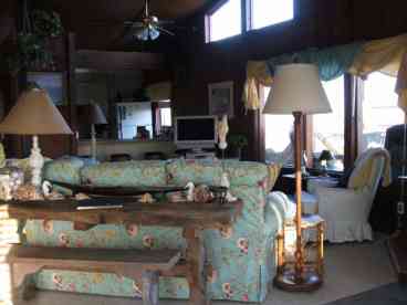 Sitting Room with a great gulf view and humming birds everywhere from the deck!