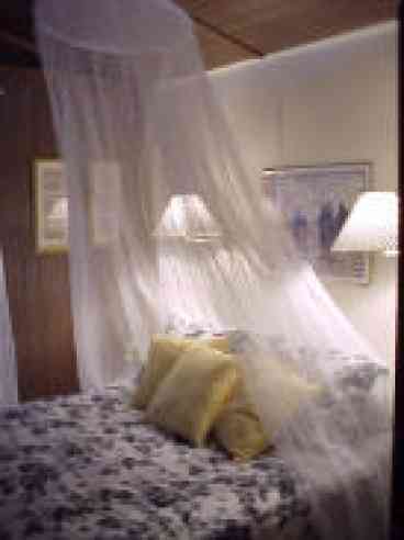 guest room with vaulted ceilings