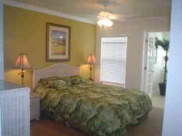 Queen size bed in Bedroom and carpet on floor