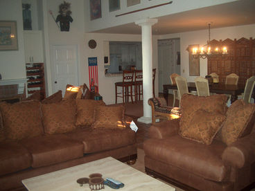 Sitting area is facing the TV, entry side. Dining to the right, kitchen right back side, living room fireplace just beyond the back sofa. 