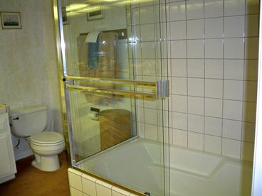 The master bathroom has a full tub/shower, double vanity sinks