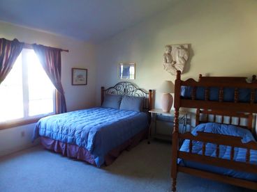 Queen bed and one set of two single bunk beds. Ensuite bathroom also