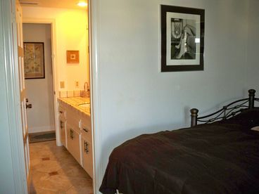 The 2nd bedroom has a king and a futon double sofa bed, shares the bathroom with guests