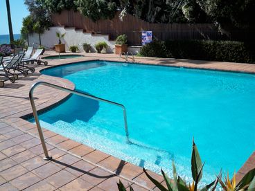 Below the condos is this large pool and hot tub patio, and an access to the beach. 