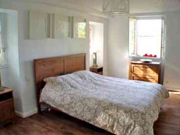 The large double bedroom overlooking the river and terrace