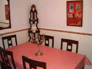 Separate Dining Room : Furnished with large wooden dining table with 8 chairs which leads through to the Kitchen.