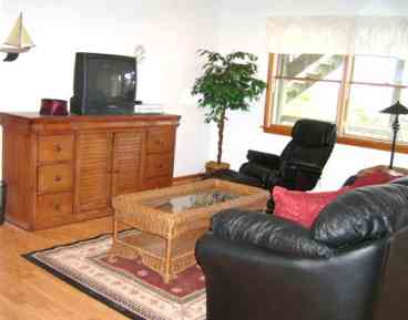 Photo of mid-level den. The den provides an additional space for Television viewing and seating.