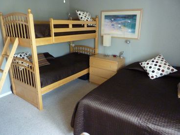 Front bedroom with queen and bunk beds.  Other bedroom has a queen bed.