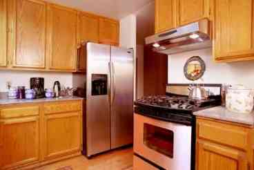 Gourmet Kitchen with Stainless Appliances & Quartz Counters.Fully Stocked with pots and pans and serving dishes for a crowd.