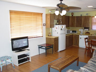 The open-concept part of the house also includes a dining table with 4 chairs (not fully visible in the photo). The kitchen includes the usual large and small appliances, cookware, dinnerware, utensils, and cleaning supplies. There is a phone for your convenience (local and toll-free calling only). The IGA grocer is down the street and around the corner. Convenience stores are scattered all around Port Aransas. Of course, you\'ll want to sample some of our excellent local restaurants. Which are good? They\'re ALL good!