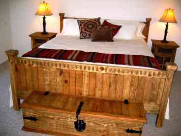 Master Bedroom with King Bed. DirecTV and flat screen tv. French doors open to pool and patio area. E-suite bathroom.