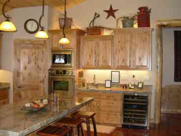 Wet Bar in Kitchen with Wine Fridge.