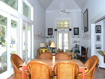 The DINING ROOM has a great view and is open to the living room. Note the hardwood floors.