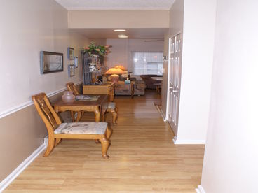 New hardwood flooring throughout (except bedrooms).