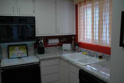 Full kitchen including pots and pans, dishes, electric stove, microwave, dishwasher, coffee maker, toaster.  Granite counter top.