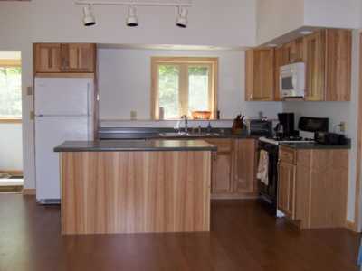 Kitchen includes dining island gas stove dishwasher and refrigerator.  Fully equipped and ready to use.
